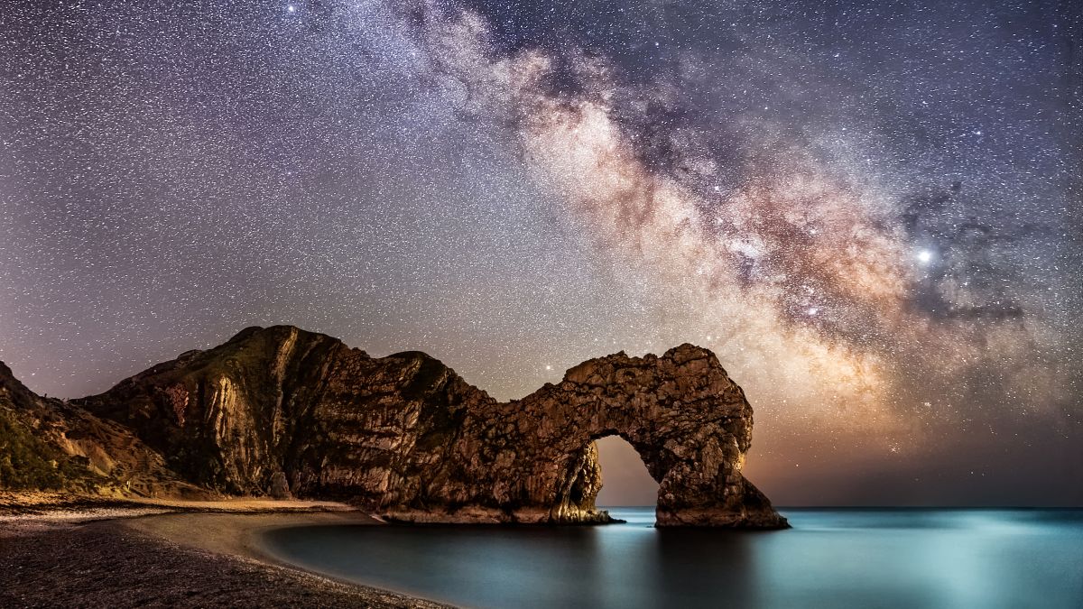 Best cameras for astrophotography: Image shows Milky Way behind durdle door in Dorset