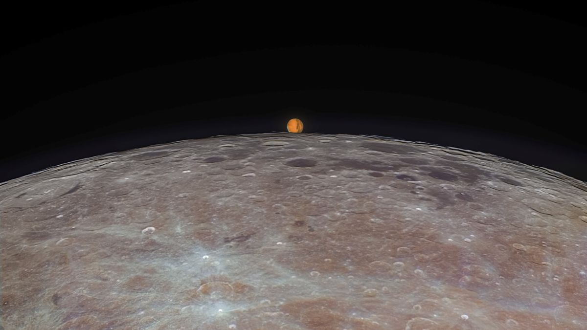 Mars reappears from behind the lunar surface after being eclipsed by the moon for around an hour.