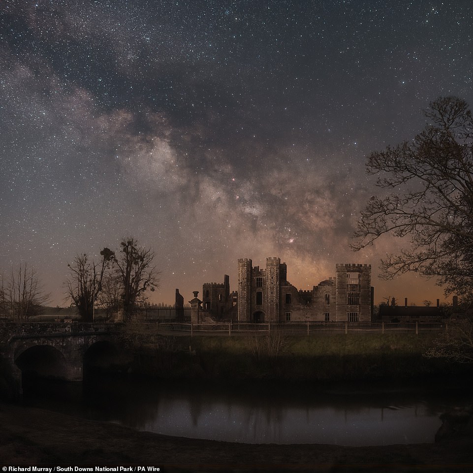 Photographer Richard Murray's 'hauntingly beautiful' photograph of the Milky Way rising over the ruins of Cowdray House in  West Sussex has won the top prize in the South Downs National Park astrophotography competition