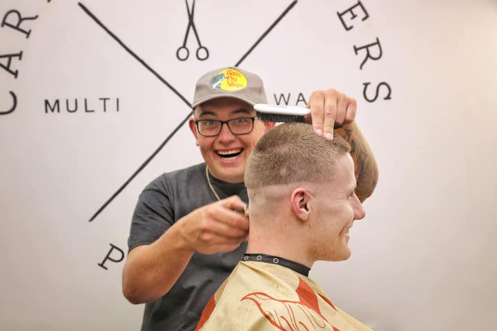 Image of barber and customer taken for 48hrs in Preston Pic: Chris Darley